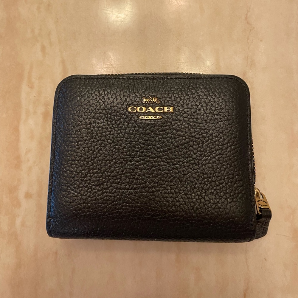 Black leather coach wallet with gold detail